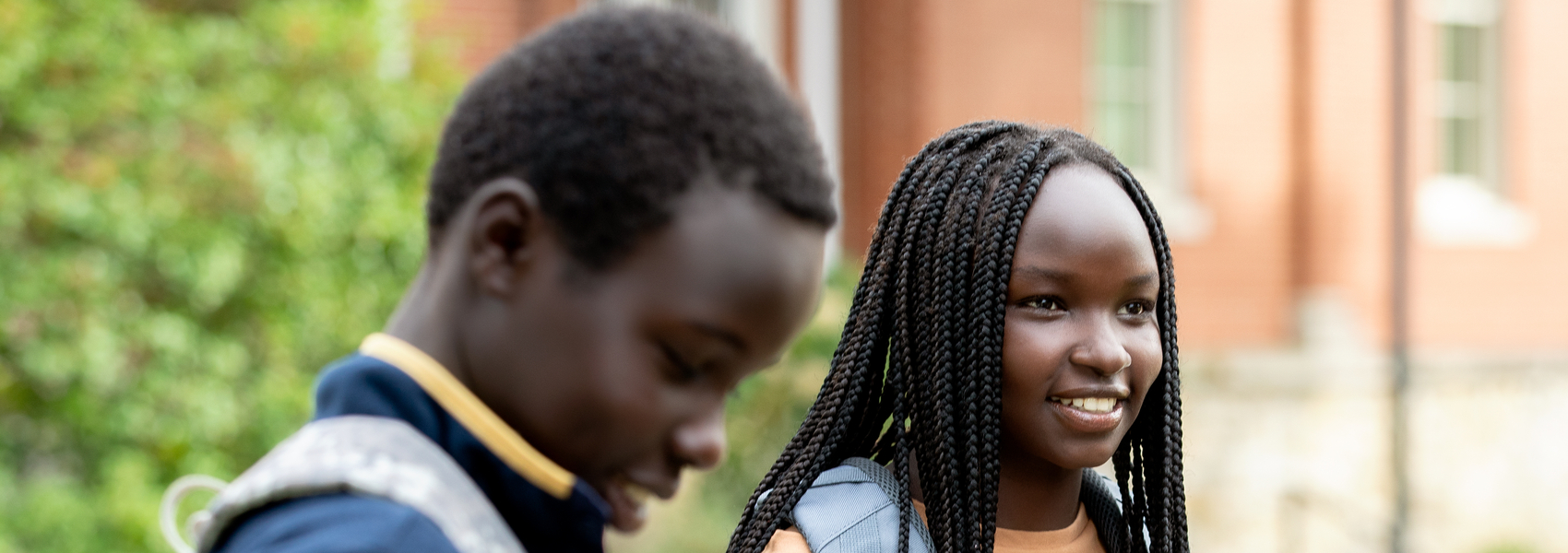 Two African teens walking to school